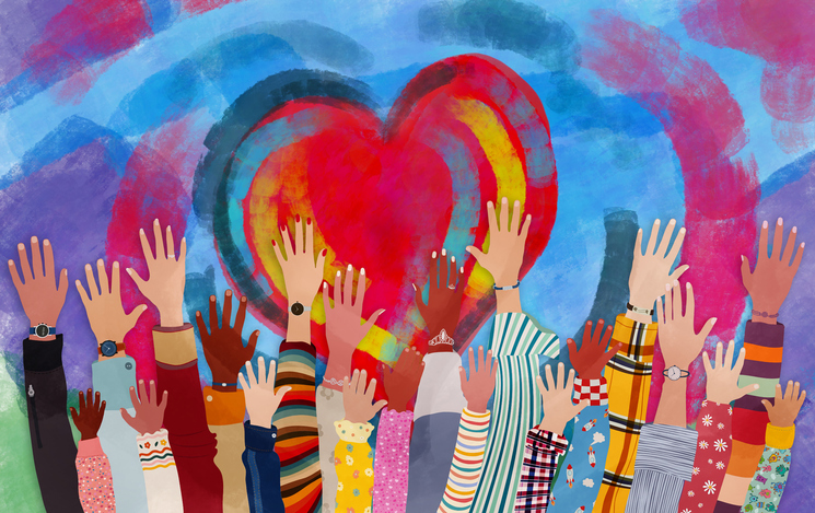 A diverse group of hands and arms reaching up toware a multicoloured heart
