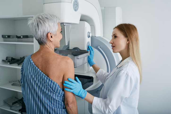 Older woman undergoing mammogram